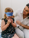 A folded silk pillowcase from Sensory Play Australia is shown next to a matching sleep mask. Both items from the Silk Pillowcase and Eye Mask Set are placed on a white background.