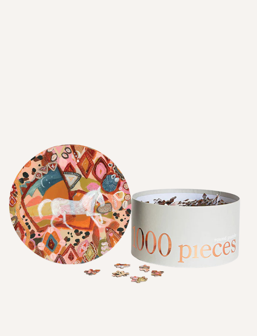 Vibrant 1000-piece round puzzle, 'When My Time Comes Around' by The Play Way, with a white horse on a patterned background, box, and pieces.