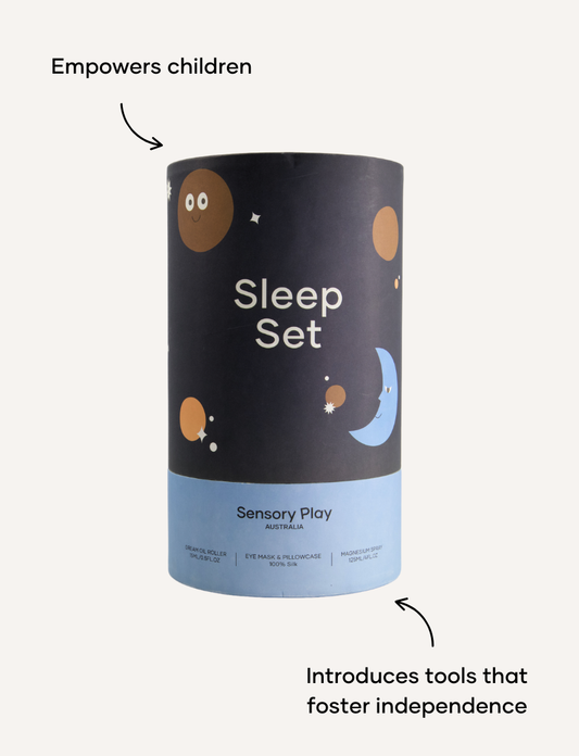 A round, light blue box labeled "Sensory Play Australia" contains the "Sleep Set," which includes a white cylindrical bottle labeled "Melo Dream," a brown spray bottle labeled "Melo," and a folded light blue fabric item, possibly an eye mask or pillowcase.