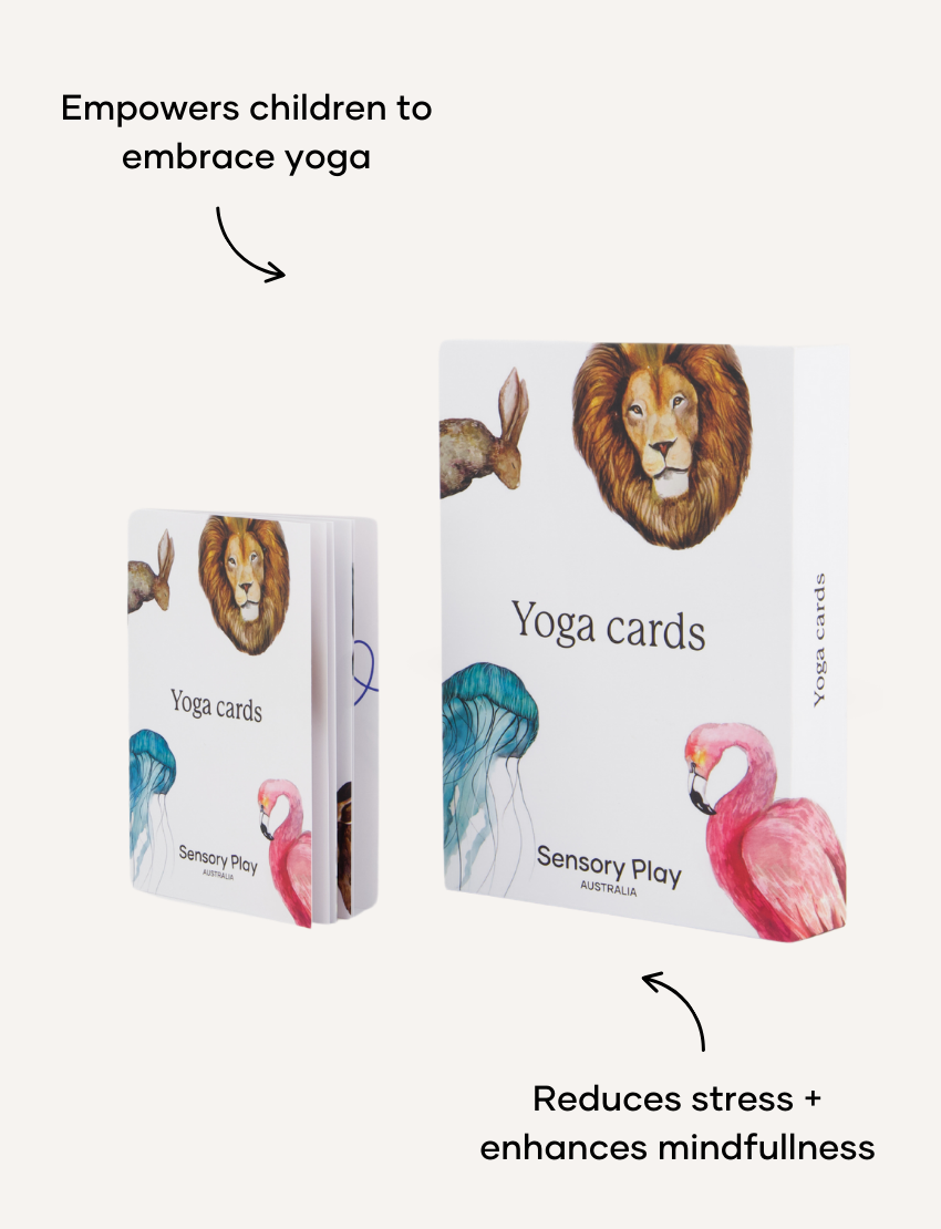 Two sets of the Yoga Card Set by Sensory Play Australia are showcased, encouraging mindfulness in children. The larger set is propped up against the smaller one, and both sets are adorned with artistic illustrations of a lion, rabbit, jellyfish, and flamingo. The packaging prominently displays the product name "Yoga Card Set" along with the brand "Sensory Play Australia.