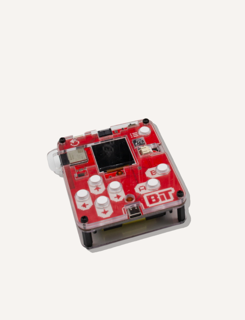 The STEM Adventure - Bit Game Console by CircuitMess is a compact handheld device with a transparent casing, showcasing red components. It includes a small screen, several white buttons, and the "8Bit" label.