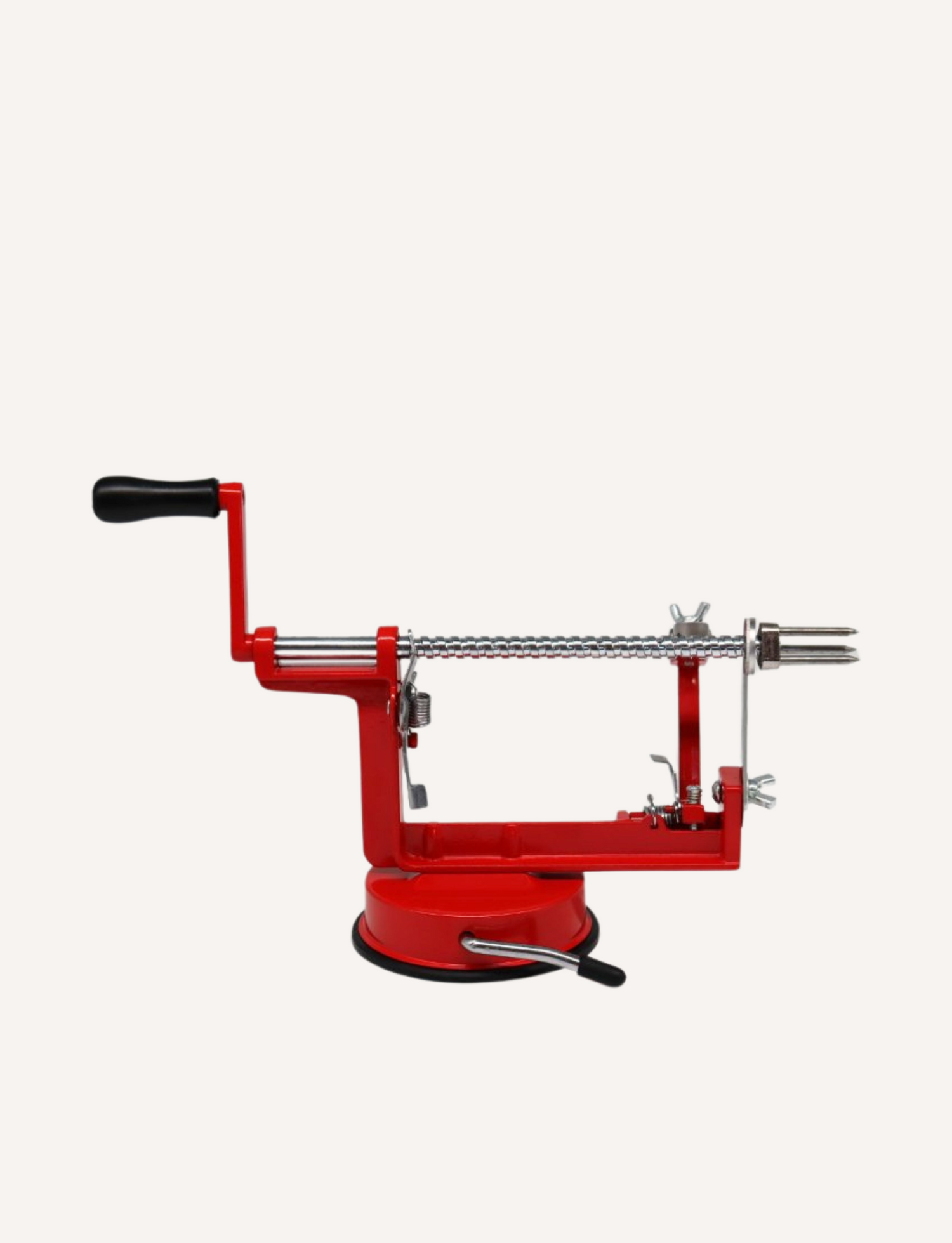 Red manual apple peeler with a clean spindle, ready to peel an apple, on a light grey background.