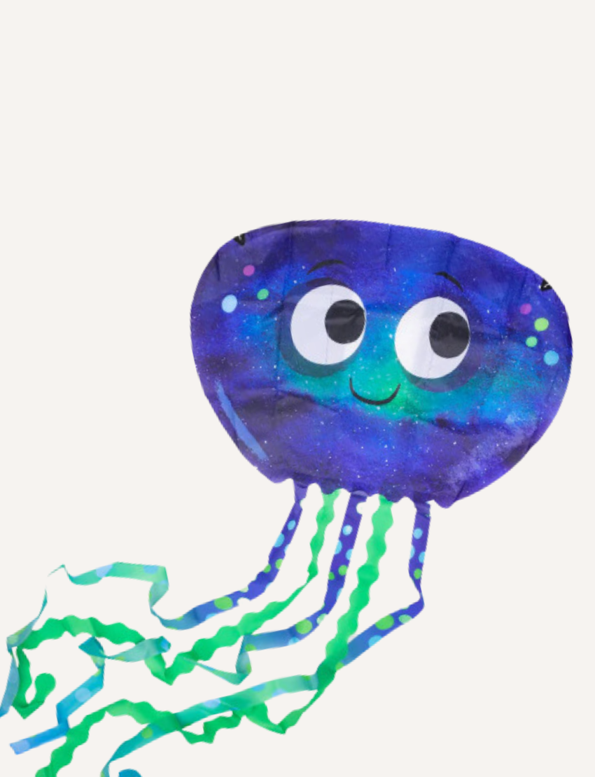 Close-up of a fun, galaxy-themed jellyfish kite with trailing green and blue ribbons.