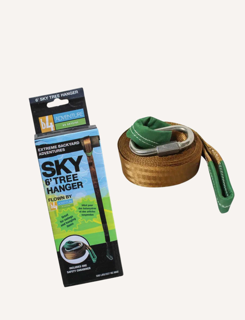 The image displays the 6-foot Tree Hanger by Slackers, with a brown strap, green ends, and a metal buckle. Its packaging, "Sky Tree Hanger," shows it mounted on a tree for backyard fun.