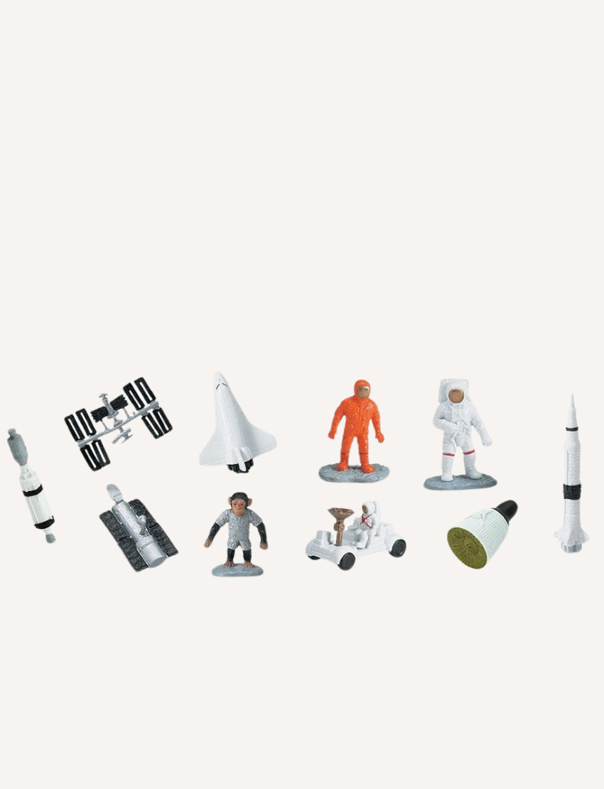 The "Space Toob" by Safari features a collection of small figurines with astronaut and space themes, including astronauts, a space shuttle, a rover, a satellite, rockets, and the International Space Station.