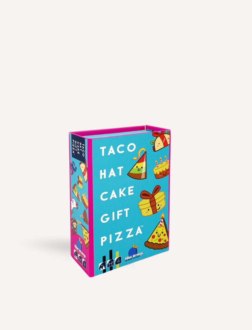 The image shows the packaging of a card game titled "Taco Hat Cake Gift Pizza Game." The box is primarily blue with colorful illustrations of a taco, hat, cake, gift, and pizza. The sides of the box are pink. The game is by VR Distribution.