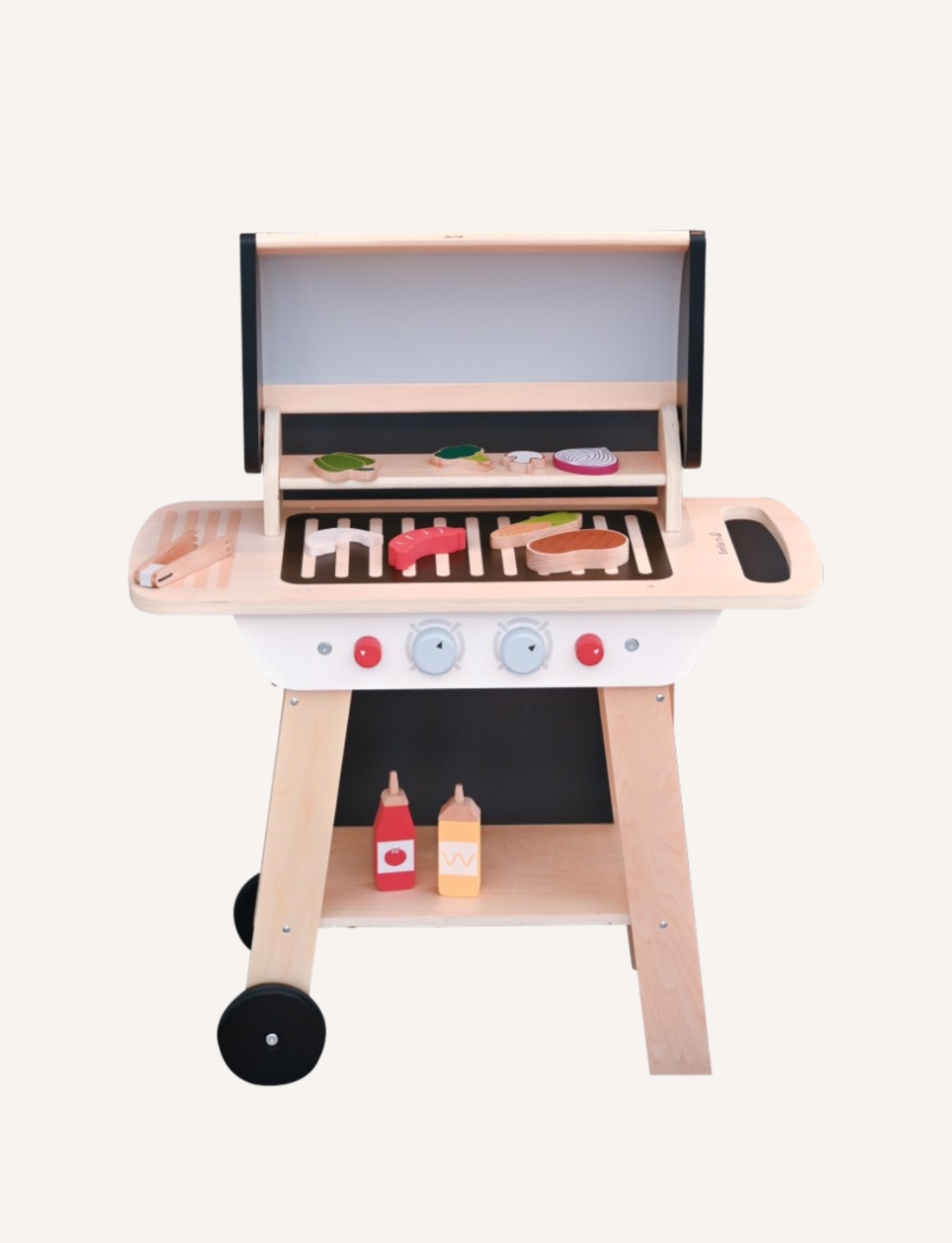 The EverEarth BBQ Play Set with Accessories is a charming wooden toy grill featuring a lid, assorted toy foods including vegetables and meats, condiments, a spatula, and equipped with two red and blue knobs plus wheels for easy mobility.