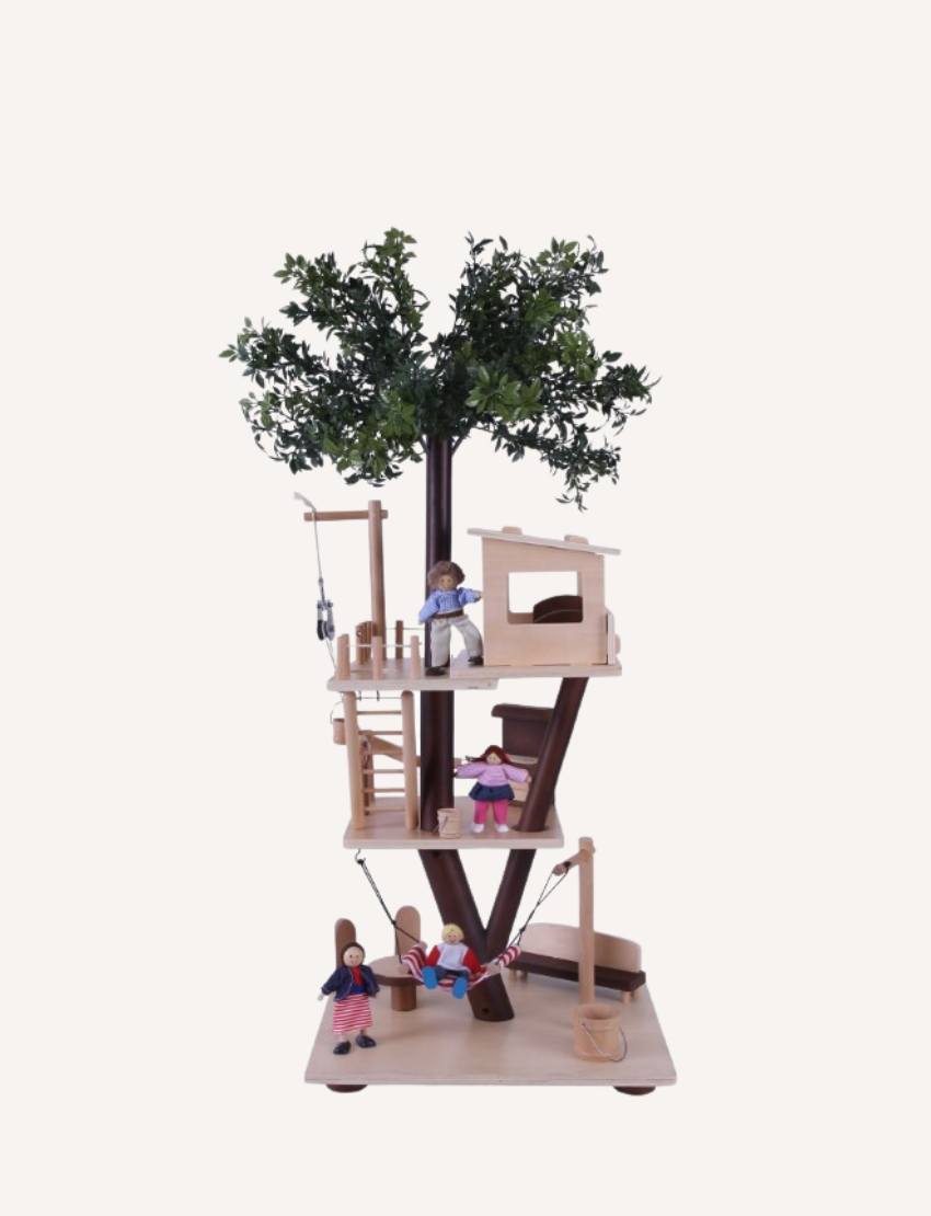 The Ever Earth Tree House is a wooden toy with three levels, featuring miniature furniture, figures, and accessories. It includes a swing on one side and a rope ladder on the opposite side. At the top, there is a small artificial tree surrounded by figures posed in various activities.