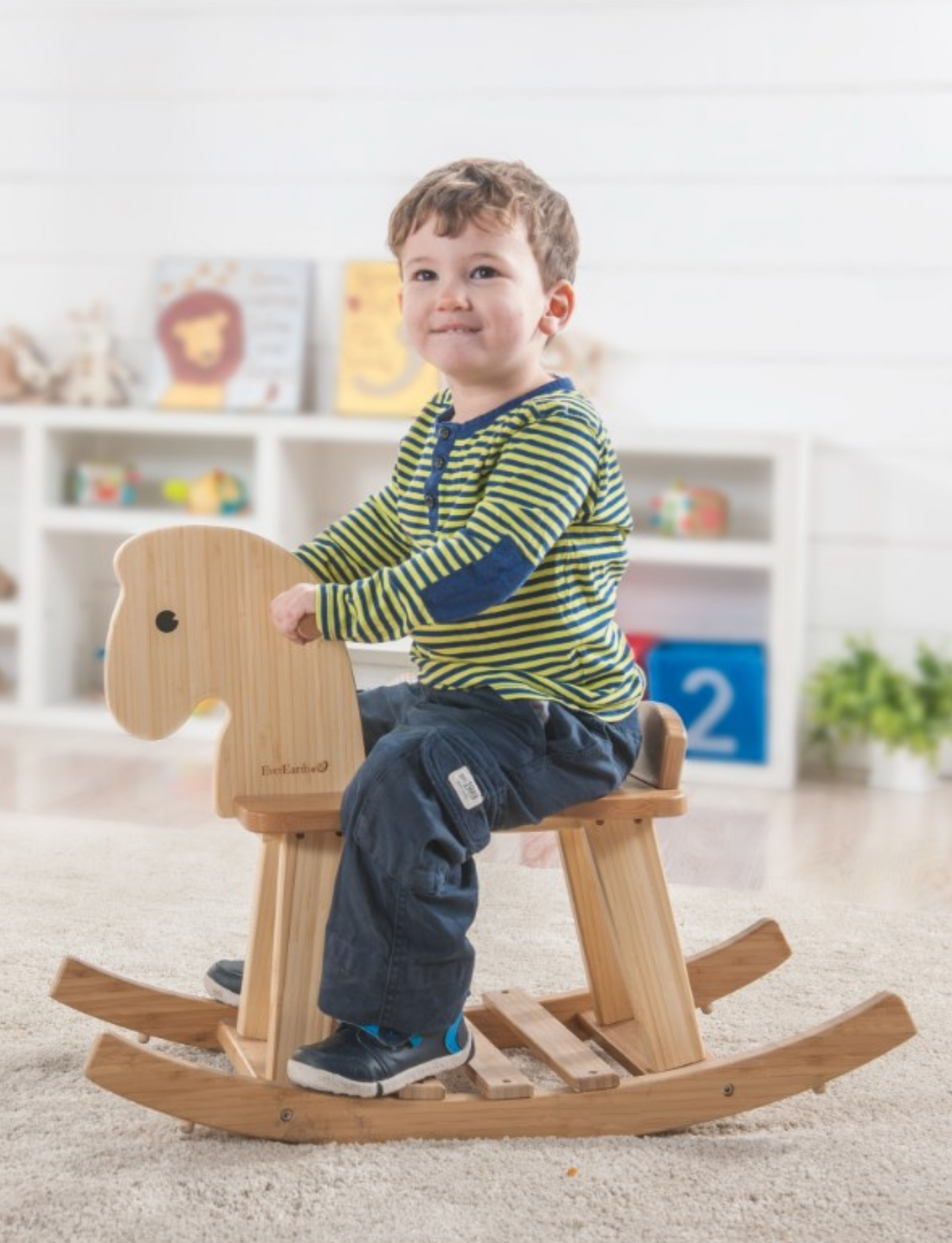 The EverEarth Bamboo Rocking Horse is an eco-friendly toy with a natural finish, offering a simple carved design, smooth seat, grip handles, and curved rockers. Its minimalistic style is ideal for children's play and aids in muscle development.