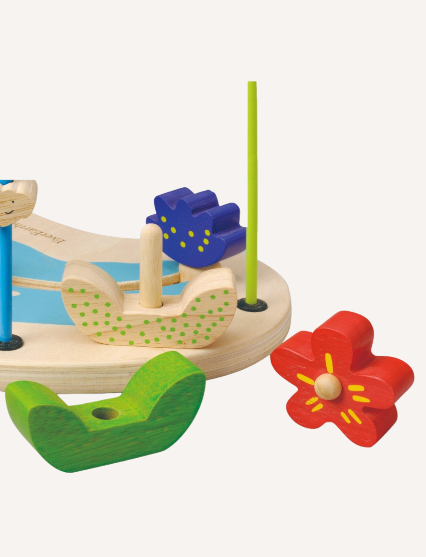 The Amazon Bead Fun by Ever Earth is a colorful wooden toy for toddlers, featuring a variety of shapes and figures, such as flowers, endangered animals, and beads. The toy includes multiple wires with beads that can be moved along the paths, designed to enhance fine motor skills and hand-eye coordination.