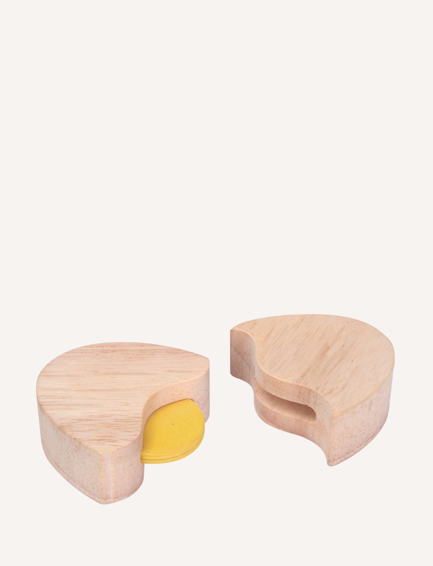 The Play Pull Along Duck & Egg by Ever Earth consists of two interlocking semi-circular pieces. One piece has a yellow disc partially concealed within a slot, while the other piece features a corresponding cut-out to accommodate the disc when assembled. The background is plain white.