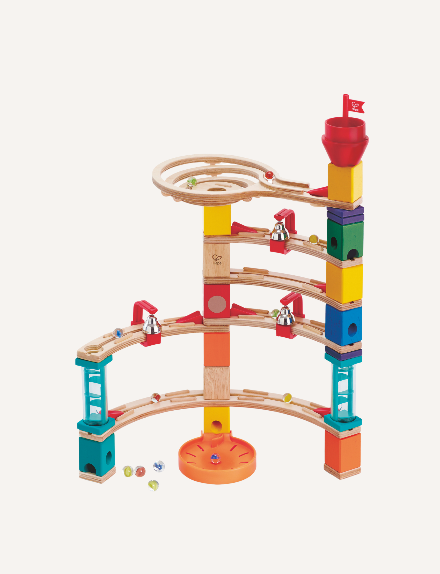 The Castle Escape by Hape is a multicolored wooden marble run set featuring a tall tower, various ramps, and a circular track at the top. Numerous marbles are scattered around the base of this STEM toy, providing both fun and educational value.