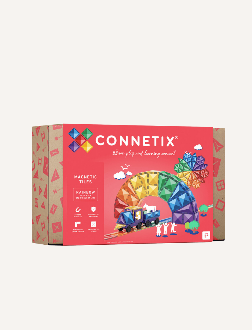 A box of the Connetix Tiles 212-Piece Magnetic Tile Mega Pack features red packaging adorned with images of vibrant geometric shapes creating a rainbow structure. The text states "Where play and learning connect" alongside warranty and safety icons.