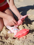 The Melody the Mermaid Dive Buddies Neon Strawberry Set of 3 by Sunnylife features three adorable plush toys on a white background, including a pink mermaid tail, an orange shell, and a white starfish with a smiley face and blue eyes—ideal companions for children's water play.