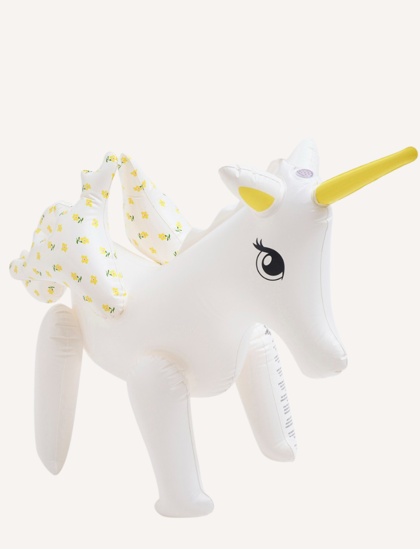 The Sunnylife Inflatable Sprinkler, named Mima the Unicorn - Lemon Lilac, is designed as a white unicorn with a yellow horn. Crafted from non-toxic PVC, this enchanting float features flower-patterned wings and a detailed eye on its head, making it both safe and captivating.