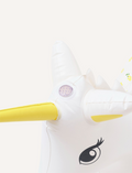 The Sunnylife Inflatable Sprinkler, named Mima the Unicorn - Lemon Lilac, is designed as a white unicorn with a yellow horn. Crafted from non-toxic PVC, this enchanting float features flower-patterned wings and a detailed eye on its head, making it both safe and captivating.