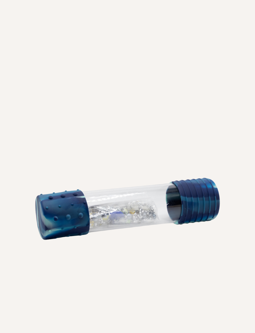 The Jellystone Designs DIY Calm Down Bottle is a clear tube with green textured caps containing liquid and an orange dinosaur figure, ideal for creating a sensory bottle. It's perfect for helping kids self-regulate during stress.