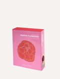 The image shows the back of a Journey of Something Paper Flower Making Kit box. The box is pink and provides instructions and images of the final product, which are light pink and dark pink paper flowers. Ideal for enhancing fine motor skills, the box also displays some icons and a barcode at the bottom.