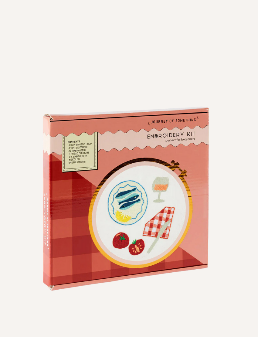 The "Journey of Something" Embroidery Kit includes a bamboo hoop and features vibrant red, pink, and blue floral patterns on the packaging. A sticker indicates its suitability for beginners, offering an easy entry into crafting.