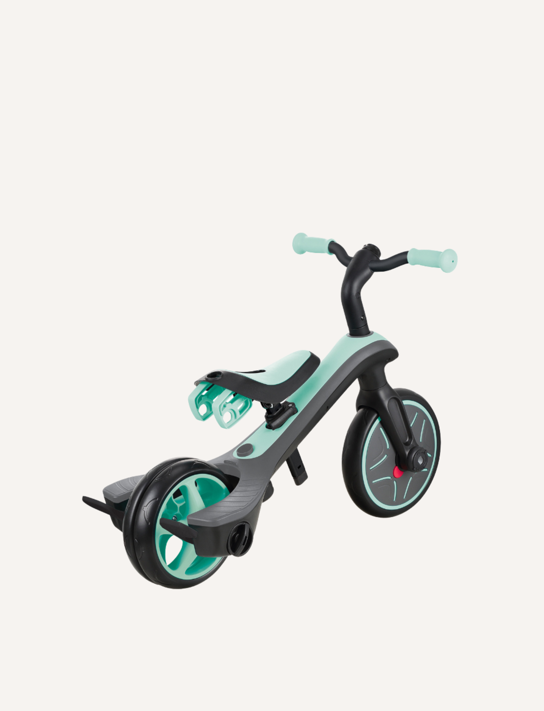 The Globber EXPLORER Trike 4-in-1 in mint features a rear handle for steering, a bucket seat with a safety bar, footrests, and a sun canopy. The tricycle has green accents and an adjustable saddle, making it perfect for young children to enjoy safe rides.