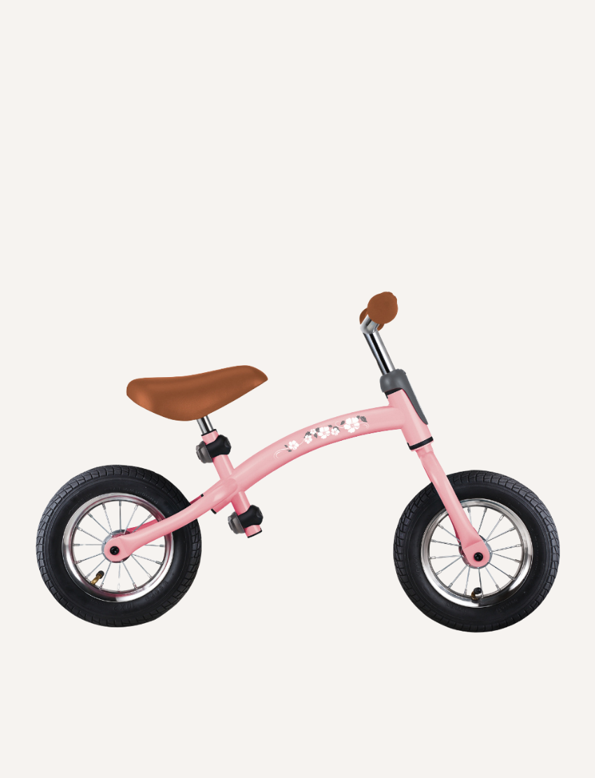 The Go Bike Air Balance Bike by Globber is a small, black balance bike featuring red handlebars and seat adjustments, specifically designed for toddlers aged 3-6. It includes two thick black tires and a checkered pattern on the frame near the seat. The bike has no pedals, aiding young children in learning balance and coordination while developing essential motor skills.