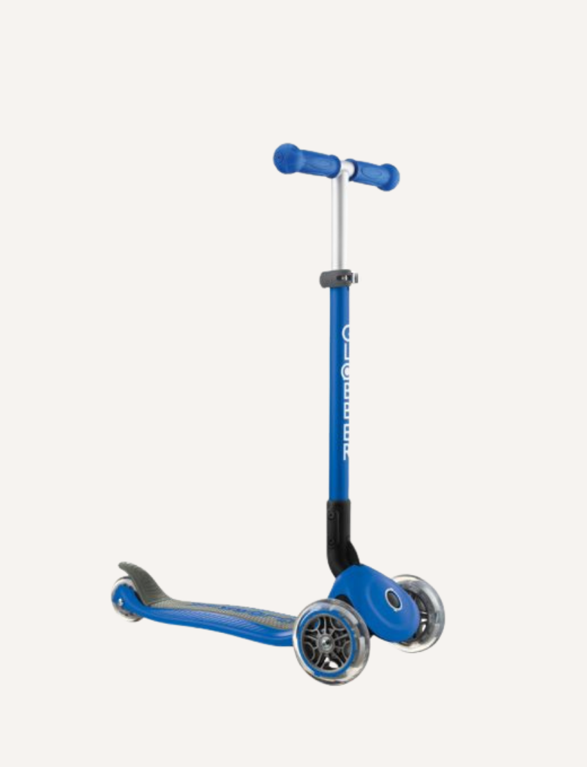 Introducing the Globber Primo Foldable Scooter, a blue children's kick scooter designed with three wheels—two in the front and one at the back. It boasts vibrant LED wheels, a T-shaped handlebar with blue grips, and a low deck for easy riding. The scooter also offers adjustable height settings for added convenience.