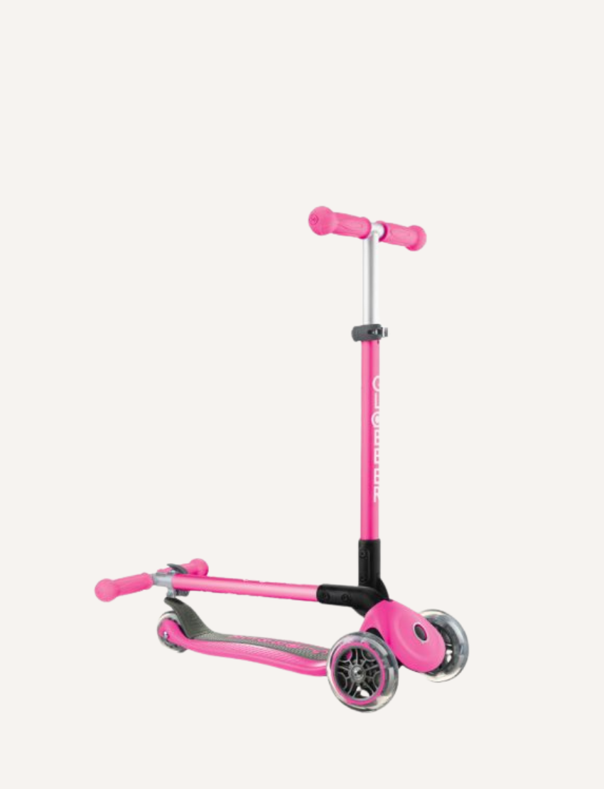 The Globber Primo Foldable Scooter is a blue three-wheeled scooter with a T-shaped handlebar offering adjustable height. It features blue grips, transparent LED-lit wheels, a standing deck, and a rear brake.