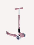 The Globber Ecologic Primo Foldable Scooter with Lights in light blue has LED front wheels, a three-wheel design, and an adjustable aluminium T-bar. The deck displays 