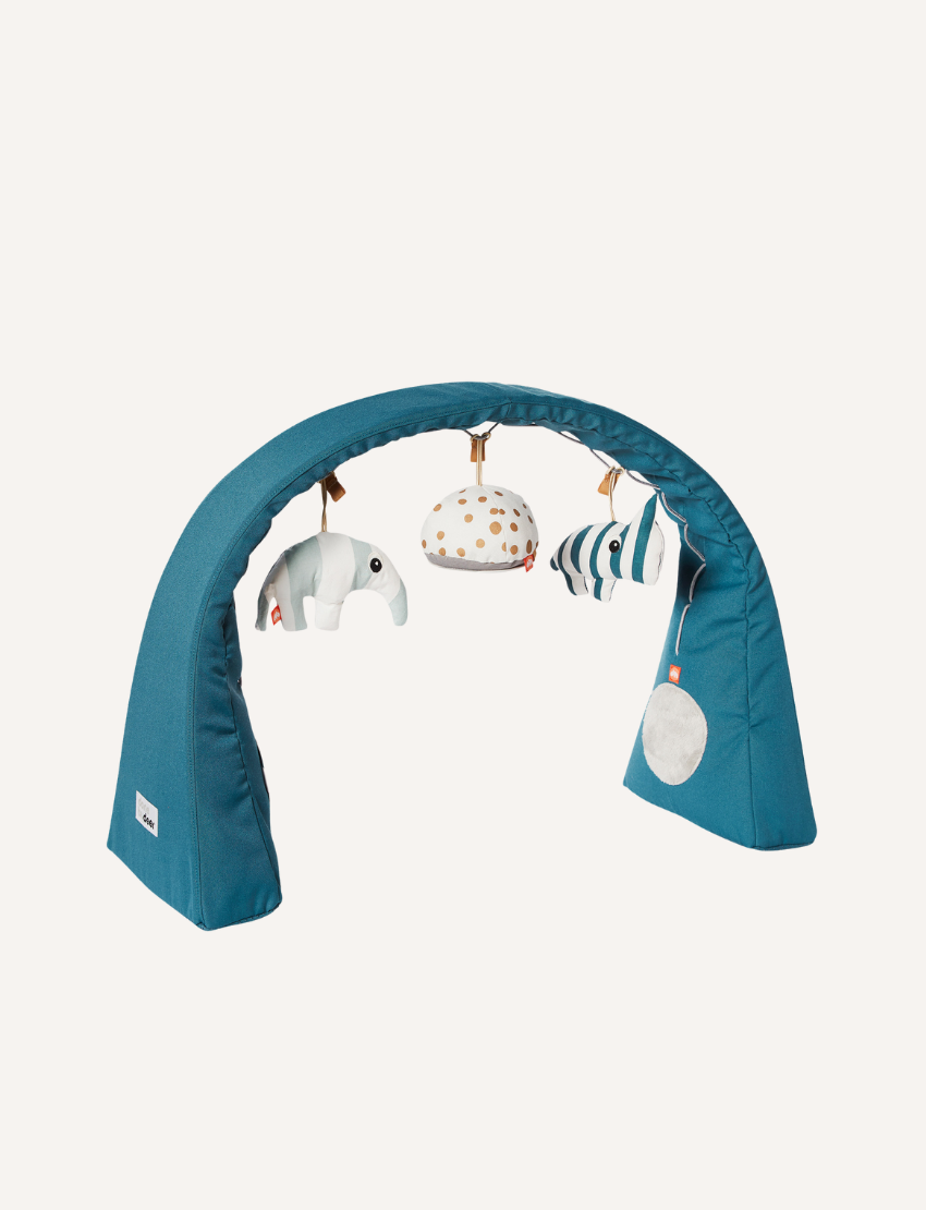 Teal activity gym with hanging plush elephant, striped zebra, and speckled ball for baby play