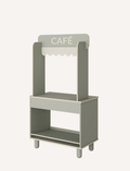 The Flexa Shop and Cafe is a grey play shop adorned with a 