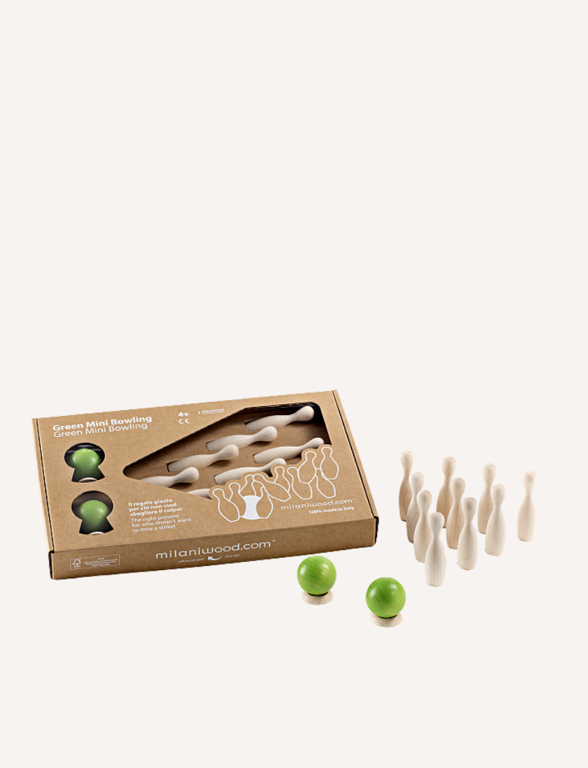 Image of a small, wooden bowling set perfect for tabletop ten-pin bowling. The Milaniwood "Green Mini Bowling" set includes ten light wooden pins arranged in a triangular formation, with two wooden balls—one green and the other light wood—in the foreground along with a small round wooden base. Ideal for family game nights.