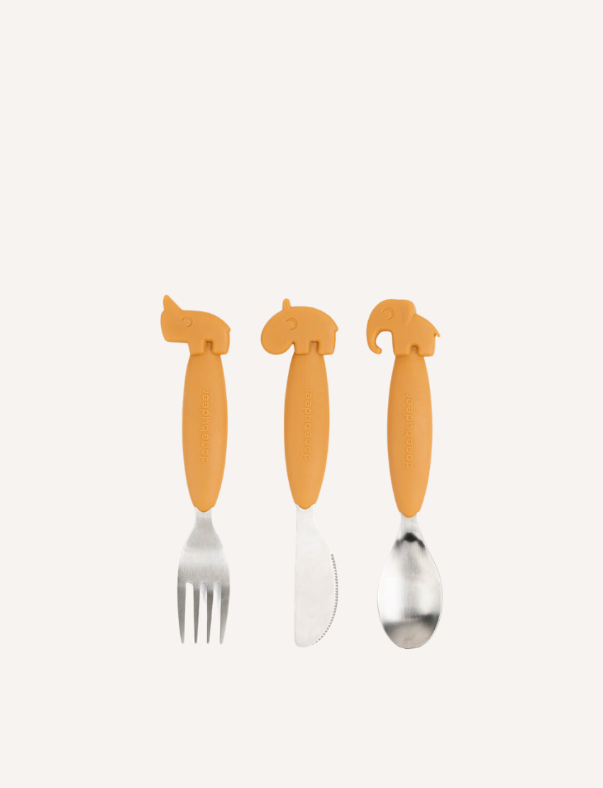 The Easy-Grip Cutlery Set by Done by Deer includes a kids' trio: a fork with a hippo handle, a knife with a rhinoceros handle, and a spoon with an elephant handle. Each utensil has light green silicone handles shaped like animals for fun mealtimes.