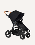 The Bumbleride ERA Pram by Bumbleride is a black baby stroller featuring a canopy and a brown handlebar. It comes equipped with four large wheels and a spacious undercarriage storage basket. The sturdy and adjustable frame makes it suitable for various terrains.