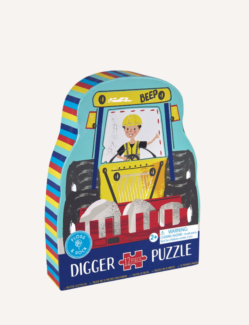 The Floss & Rock 12-Piece Shaped Puzzle - Construction comes in a colorful digger-shaped box with a smiling construction worker in a yellow helmet, ideal for motor-skill development for ages 2 and up, and features striped packaging on the sides.