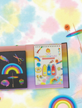 A DIY craft kit from Tiger Tribe is displayed, including a Rainbow Lab - Playing with Colour booklet titled 