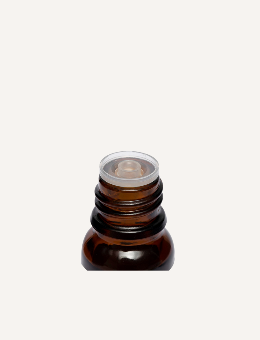 A small amber-colored bottle with a black screw cap is labeled "Natio" and "Focus on Essential Oil Blend." The label also includes the phrases "breathe deep, slow down," and the bottle contains 25 ml (0.81 fl oz) of liquid, perfect for a diffuser or massage with pure essential oils.