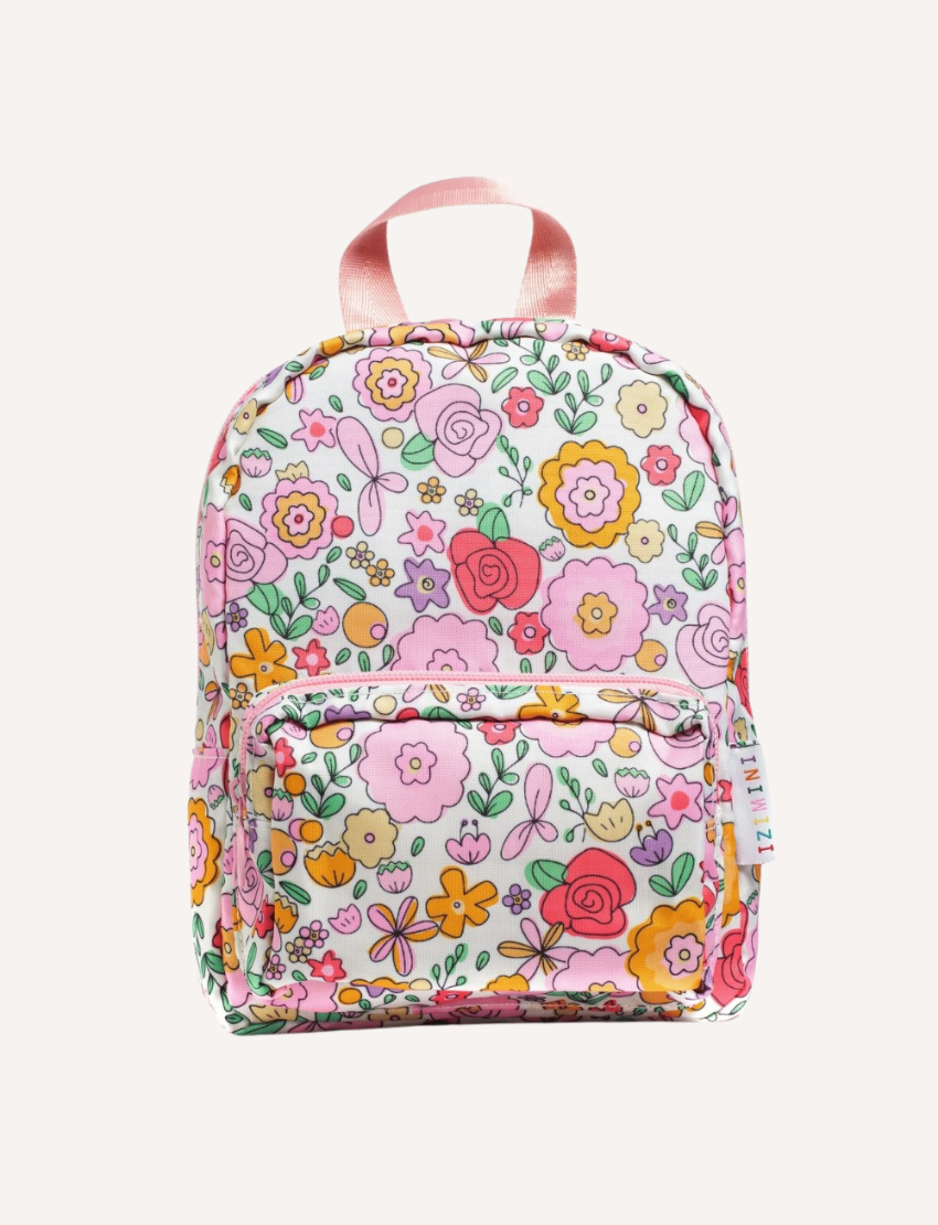 The IZIMINI Mini Backpack, featuring a cream-colored base adorned with a playful fruit pattern—including avocados, bananas, pineapples, and watermelons—is perfect for your toddler. It boasts mint-green straps and zipper pulls, a small exterior pocket, and plenty of space for little essentials.