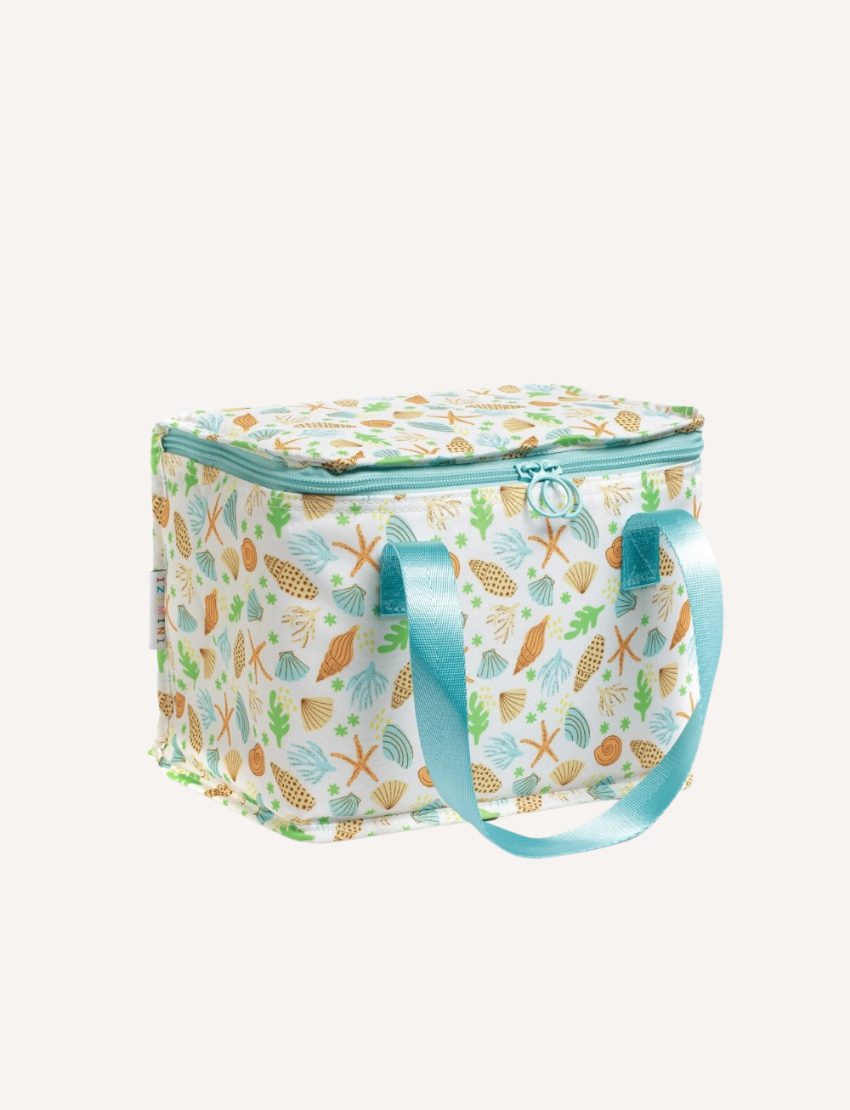 The IZIMINI Sailor Lunch Bag is a rectangular insulated lunch bag featuring a white background adorned with a colorful seashell pattern. It boasts a turquoise zipper and matching handles, and has a structured shape that stands upright.