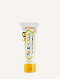 A 50g tube of Jack N' Jill Banana Toothpaste with a delightful natural banana flavor. The label highlights its Ecocert Certification and the fact that it is calendula and fluoride-free. Enriched with xylitol, the design showcases vibrant banana imagery.