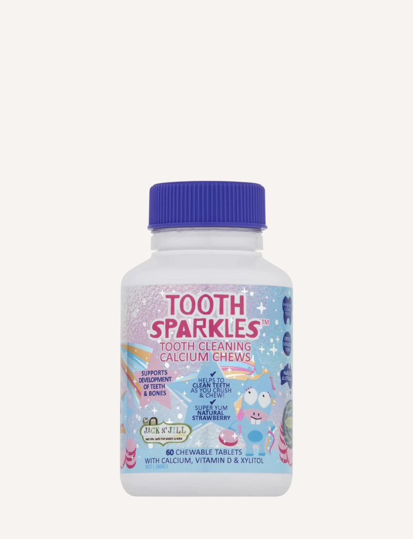 A white bottle with a purple cap is labeled "Tooth Sparkles - Tooth Cleaning Chews" by Jack N' Jill. The label showcases colorful illustrations of planets and characters. It contains 60 chewable tablets enriched with calcium, vitamin D, and xylitol, offering sensory-friendly dental care for strong teeth.