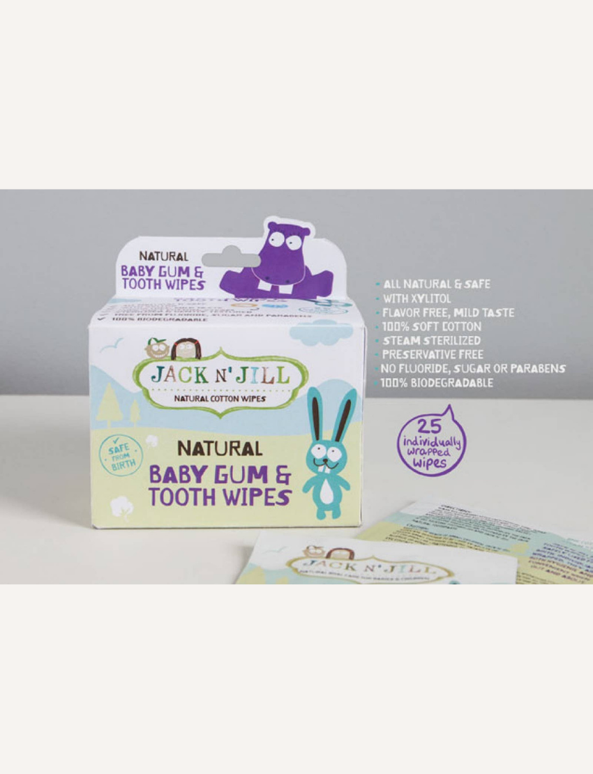 The image features a package of Jack N' Jill Baby Tooth and Gum Wipes. The packaging, decorated with charming animal illustrations, indicates that it is safe for use from birth and contains natural cotton wipes enriched with xylitol.