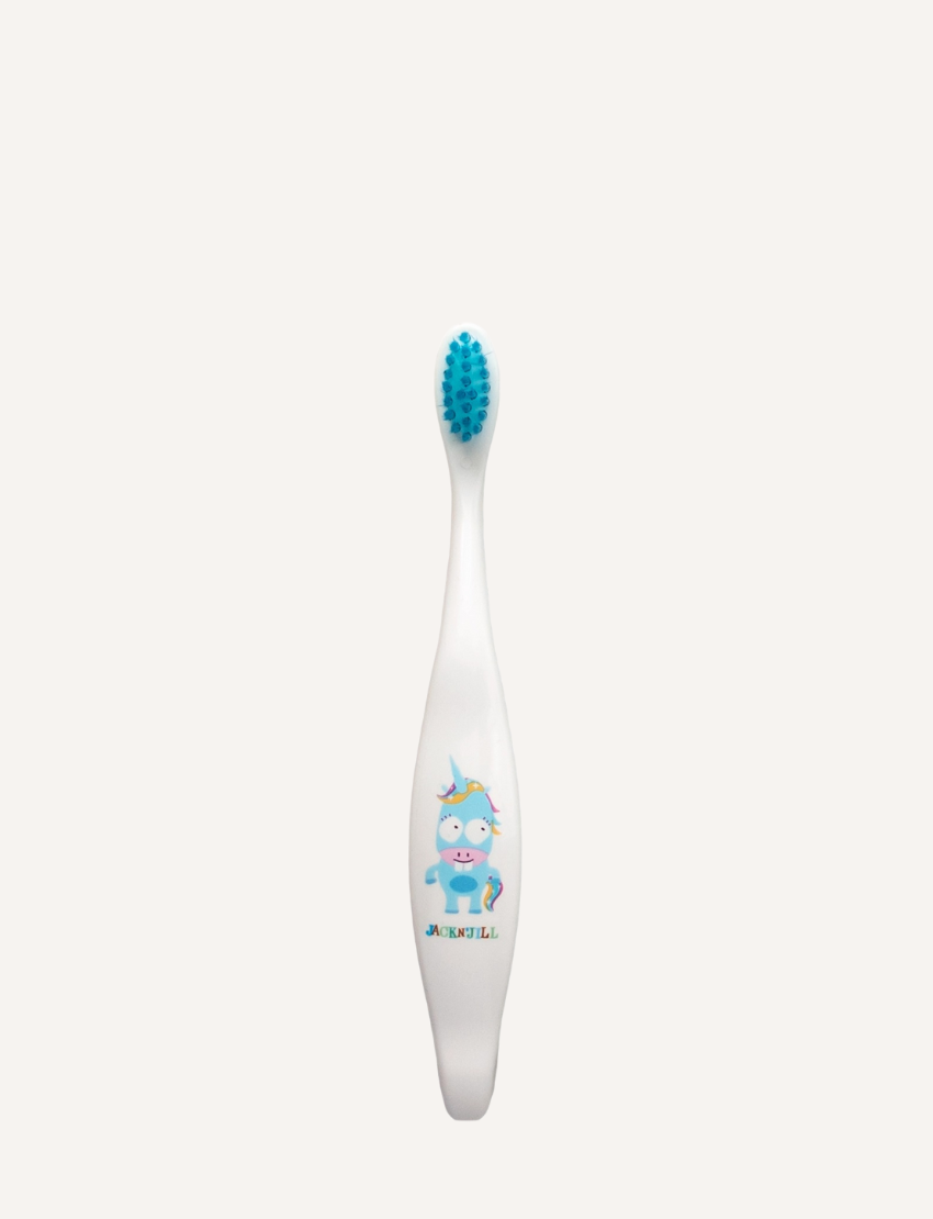 Jack N' Jill's Biodegradable Toothbrush features a white handle and a blue head with a cartoon character wearing glasses and a unicorn horn. This eco-friendly design makes brushing fun for kids while supporting oral care and the planet.