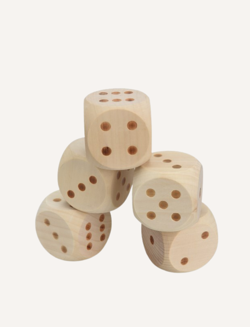 A cylindrical container labeled "Outdoor Yatzy" by Formula Sports and Games, featuring a blue and black design. It states: "5 dice, each measuring 5 x 5 x 5 cm, made from high-quality wood, with a score sheet included." A photo of someone playing dice on the grass is visible on the lower section.