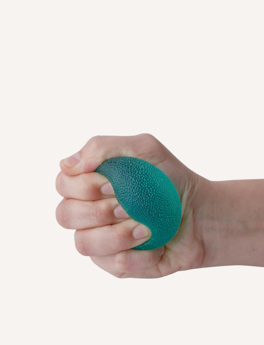 Three stress balls from Sensory Genius are stacked vertically against a plain white background. From top to bottom, the textured rubber balls in this set of three are colored pink, yellow, and teal.