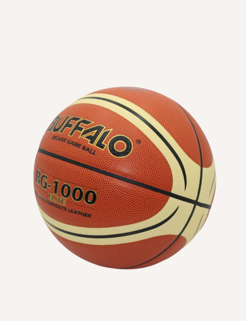 A composite leather basketball branded as "Buffalo Sports" and named the "1000 Elite Premium Composite Basketball - Size 6," featuring alternating orange and yellowish beige panels. Its ultra-grip design is enhanced by moisture-absorbing material for superior performance.