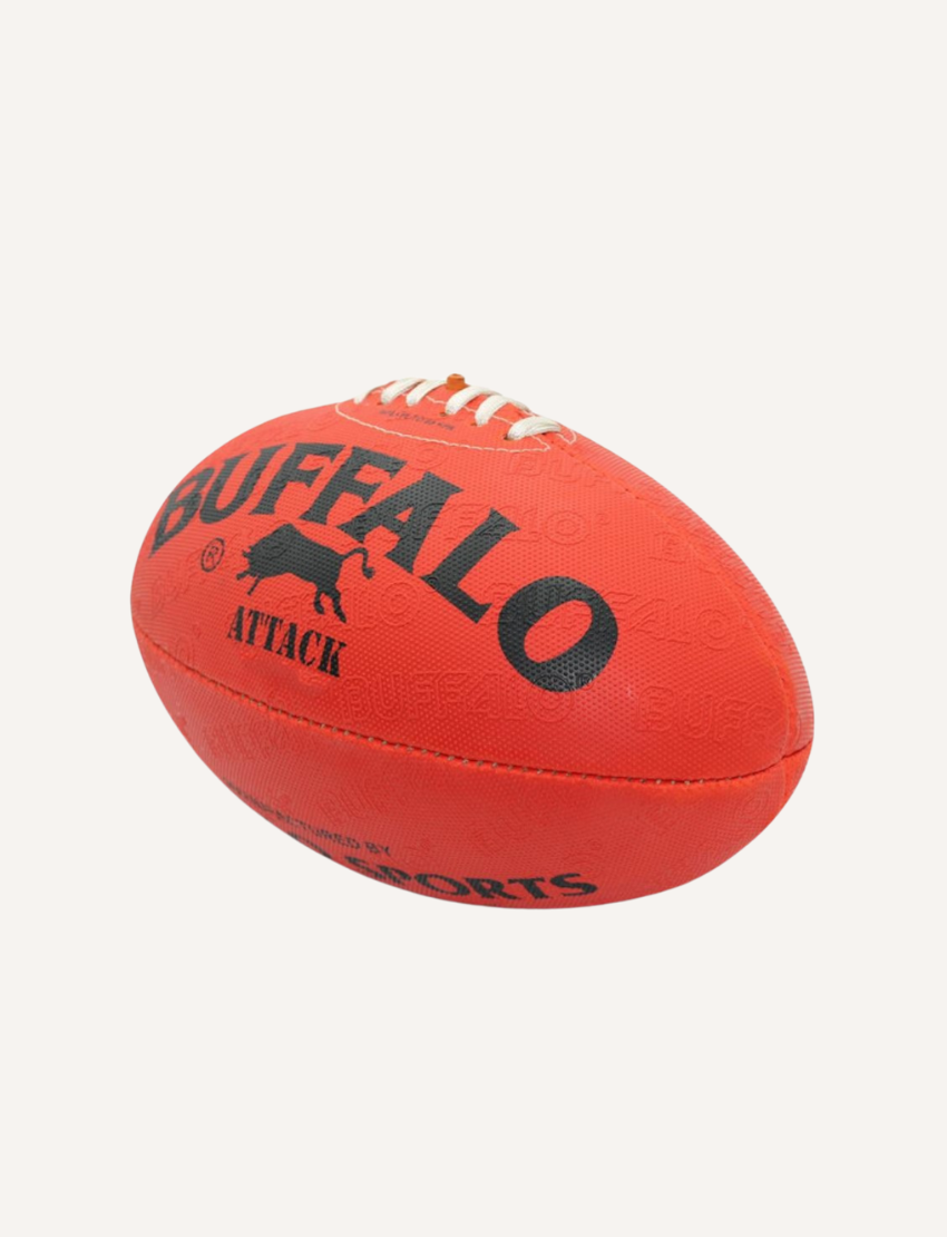 A red, durable All Weather Synthetic Football - Size 5 from Buffalo Sports features the "Buffalo Attack" branding and a black buffalo silhouette on one side, ideal for junior training sessions.