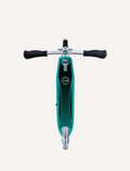 The Flow Element Scooter with Lights by Globber, featuring a sleek black and silver design, is shown. It has handlebars with black grips, a stand, and a rear brake. The scooter is positioned against a white background.