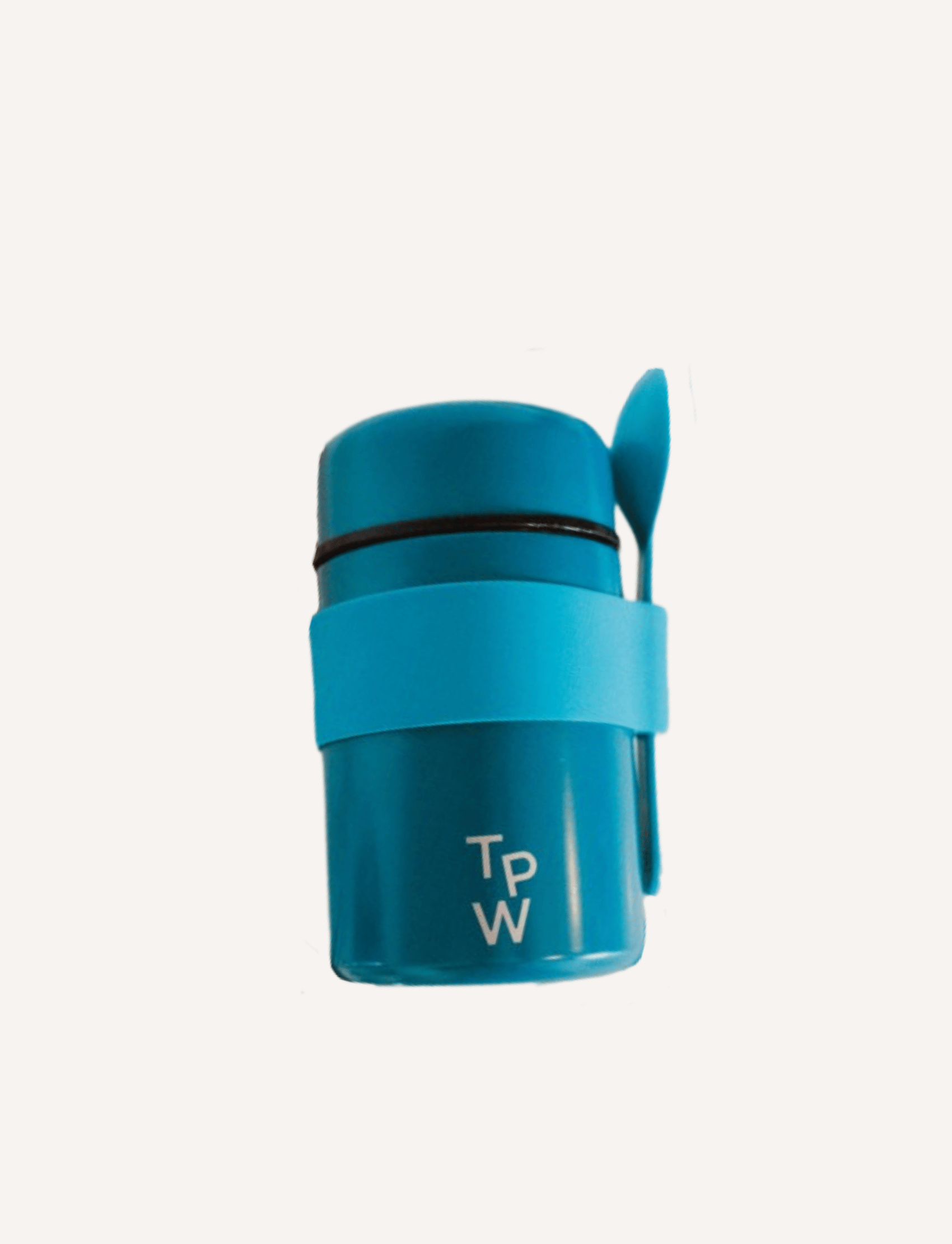 A young girl holding a small blue Lunch Buddy Insulated Container from The Play Way, featuring a leak-proof lid and the brand's initials "T P W" engraved on it. The focus is on the stainless steel container, with the girl slightly blurred in the background. Her nails are painted pink.