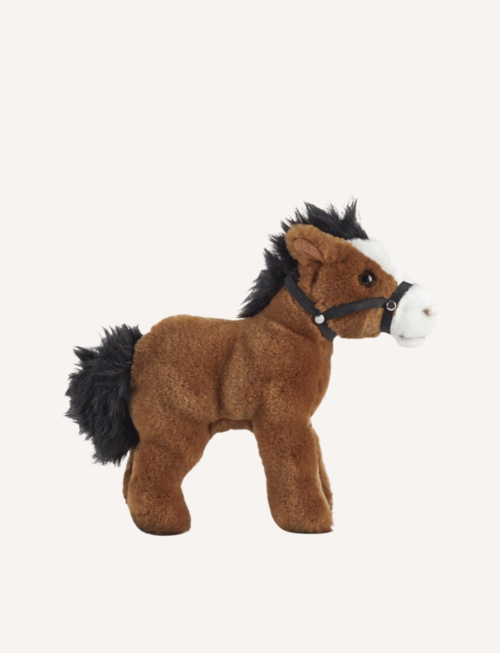 The Living Nature Horse from Living Nature stands against a plain white background. This premium horse soft toy features a brown body, black mane and tail, and a white snout, accented with a tiny black halter. Made from 100% post-consumer recycled plastics, this plush toy is not only adorable but eco-friendly too.