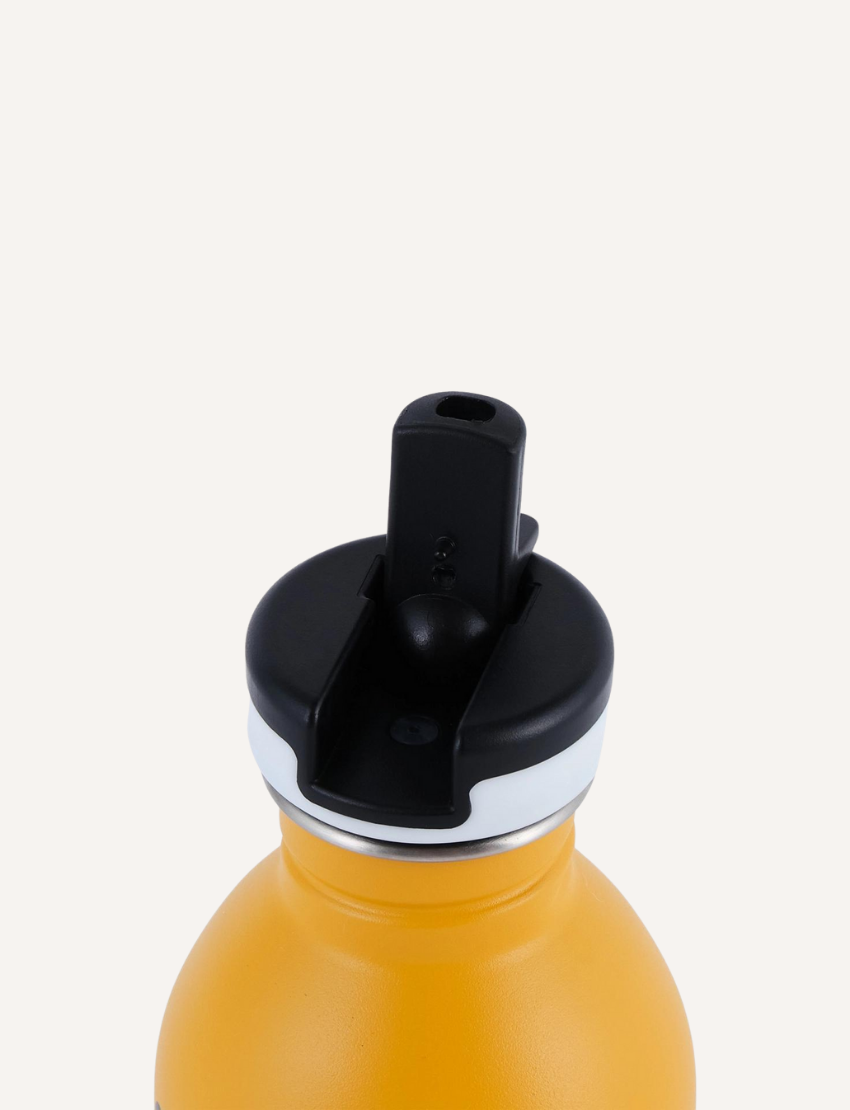 A close-up of the top portion of a yellow Noodoll Stainless Steel Bottle featuring a black spout lid. The lid includes a convenient flip-up straw for drinking. The plain background emphasizes the bottle and its distinctive features.